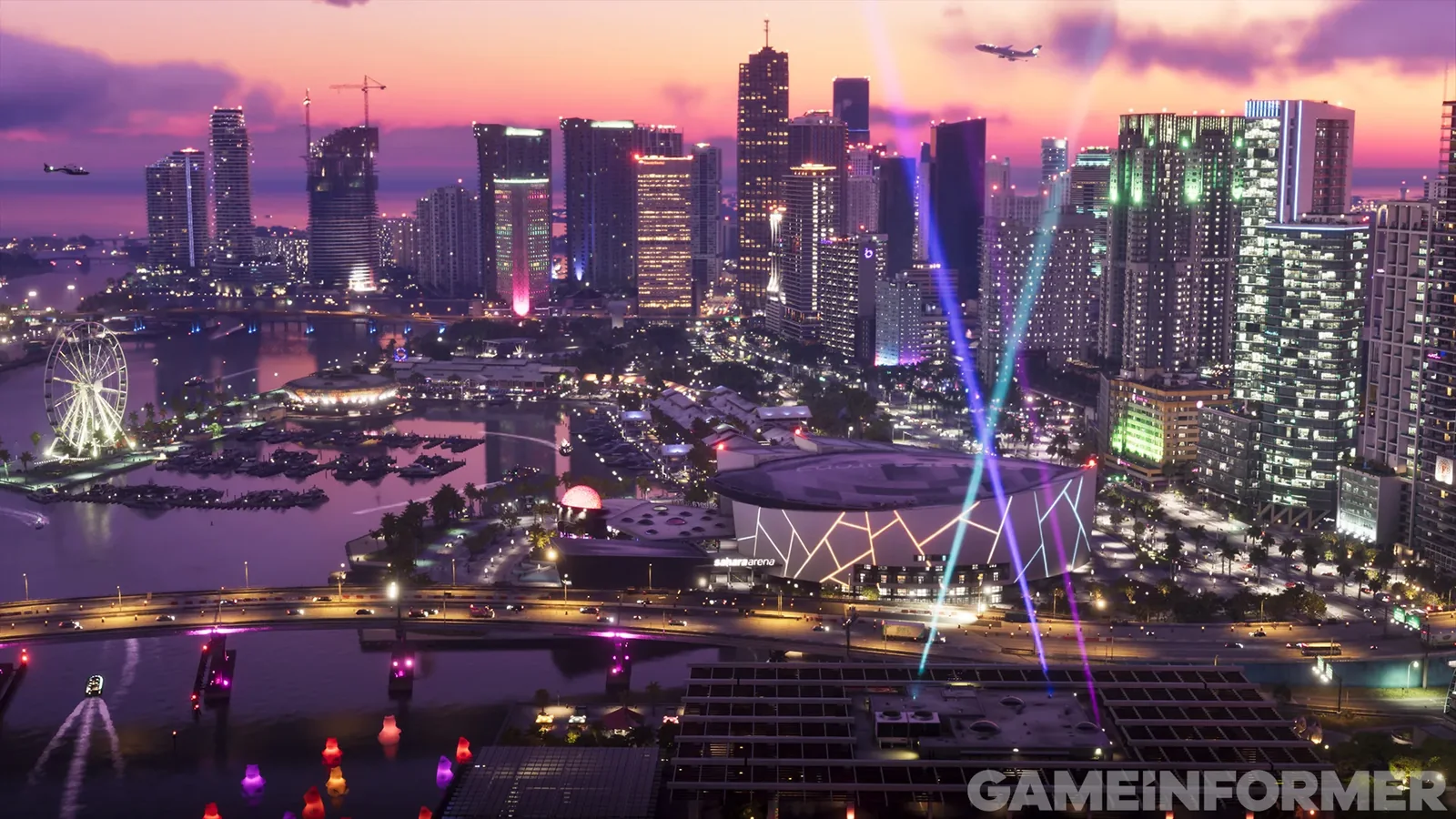 Vice City de nuit vue du ciel, avec la Sahara Arena et ses faisceaux lumineux